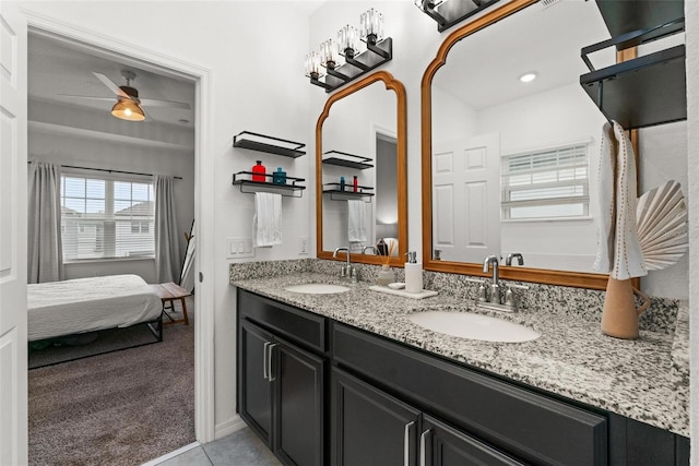 bathroom featuring ceiling fan and vanity