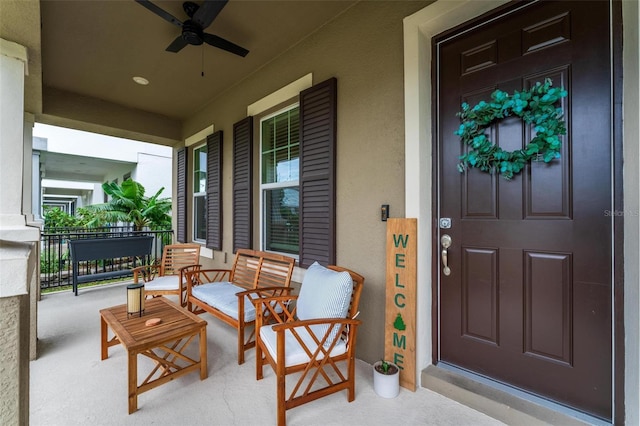 property entrance with ceiling fan and covered porch