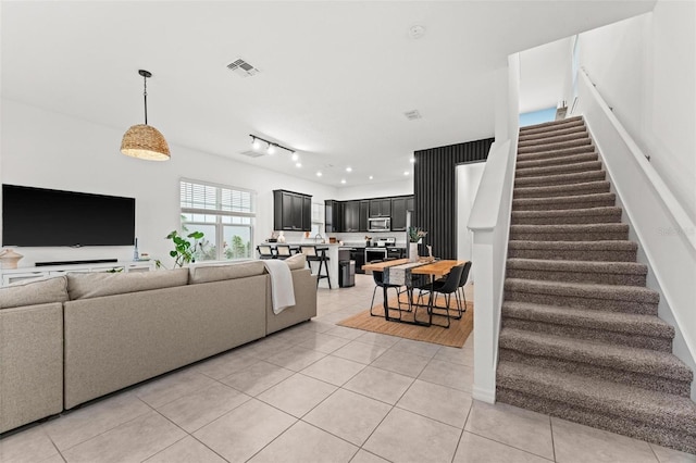 living room with light tile patterned floors