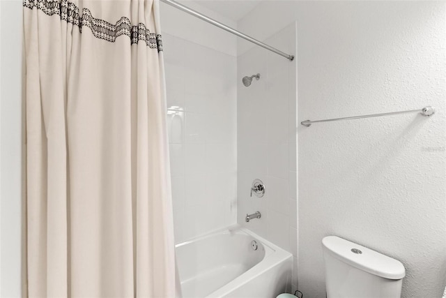 bathroom with shower / bath combo and toilet