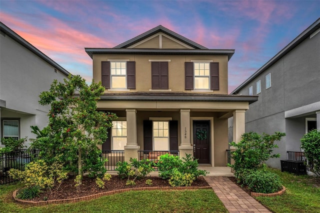 front facade featuring covered porch