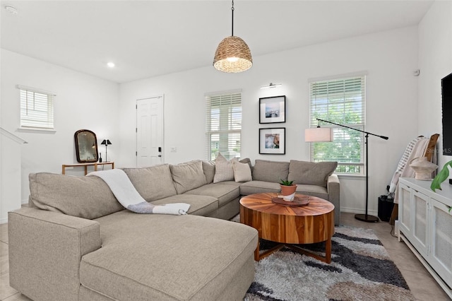 tiled living room with a wealth of natural light