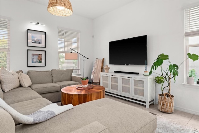 tiled living room with plenty of natural light