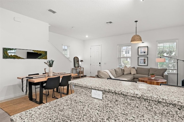 living room with light tile patterned floors