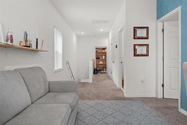 living room featuring light carpet