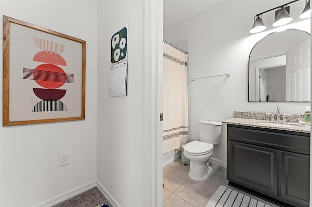 bathroom featuring vanity, curtained shower, tile patterned floors, and toilet