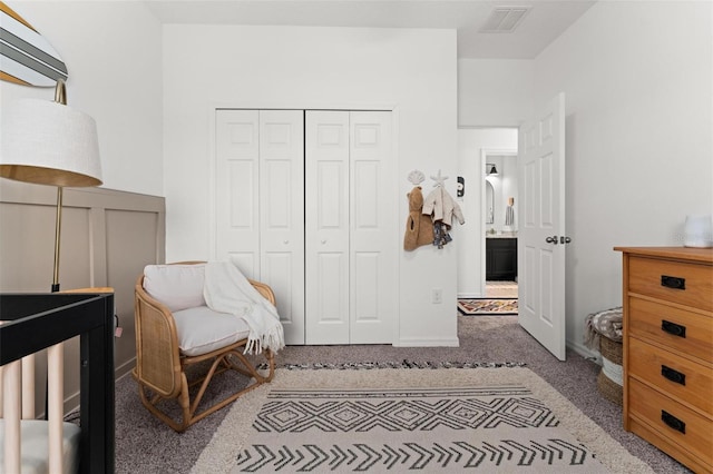 carpeted bedroom with a closet