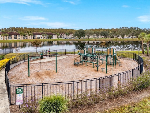 view of jungle gym featuring a water view