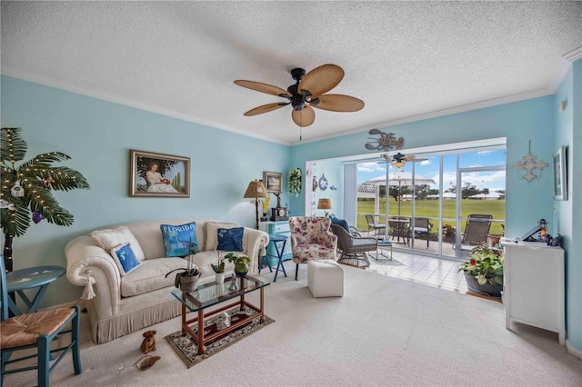 living room with ceiling fan, carpet, a textured ceiling, and ornamental molding