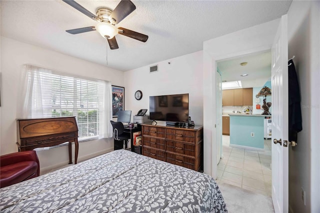 tiled bedroom featuring ceiling fan and a textured ceiling