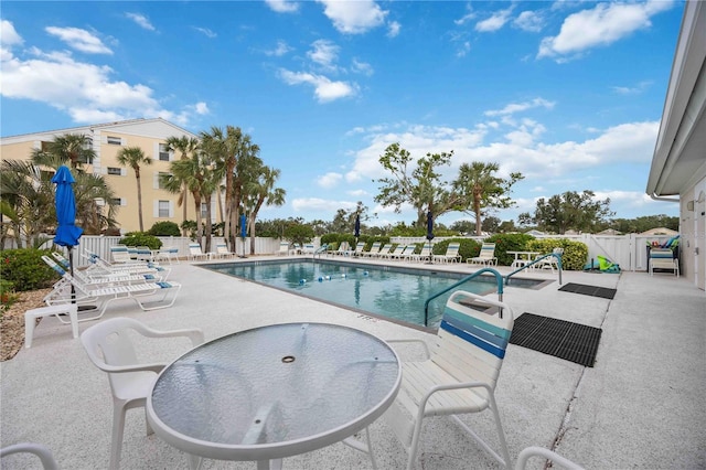 view of swimming pool featuring a patio