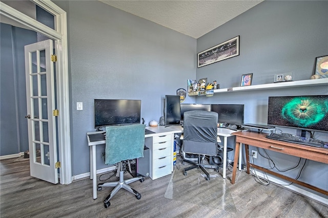 office featuring a textured ceiling and hardwood / wood-style flooring