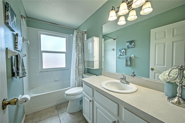 full bathroom featuring vanity, tile patterned floors, toilet, a textured ceiling, and shower / tub combo with curtain