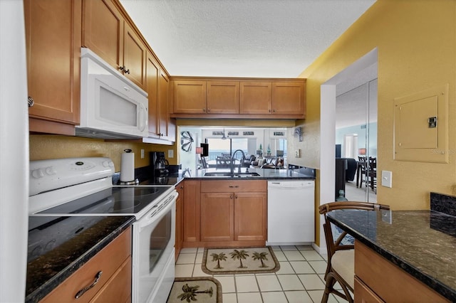 kitchen with sink, electric panel, a textured ceiling, white appliances, and light tile patterned floors