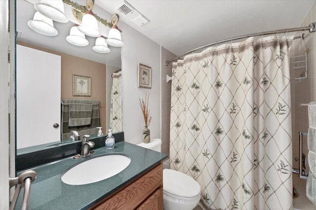 bathroom with a shower with curtain, vanity, and toilet