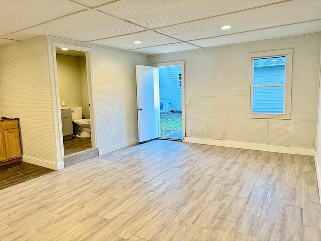 spare room featuring light hardwood / wood-style flooring