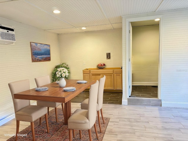 dining area featuring a wall mounted air conditioner