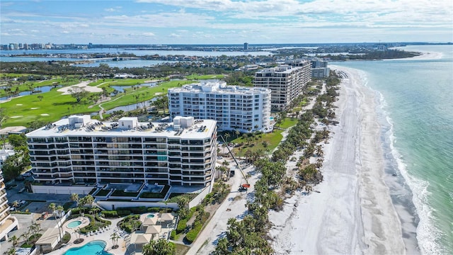 aerial view with a water view and a view of the beach