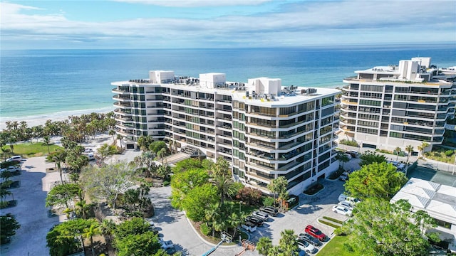 birds eye view of property featuring a water view and a view of the beach