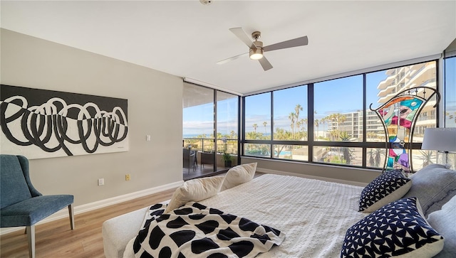 bedroom featuring hardwood / wood-style floors and ceiling fan