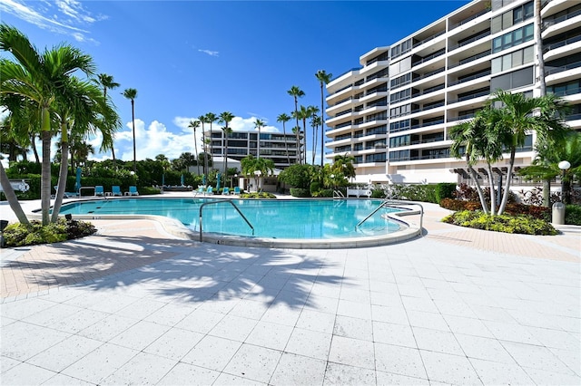 view of swimming pool with a patio