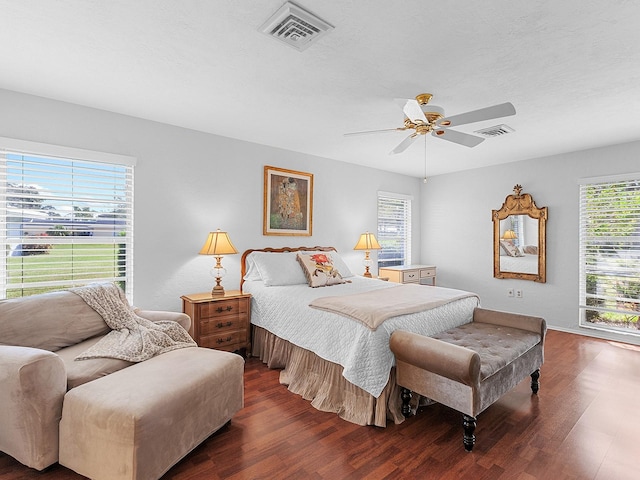 bedroom featuring dark hardwood / wood-style floors and ceiling fan