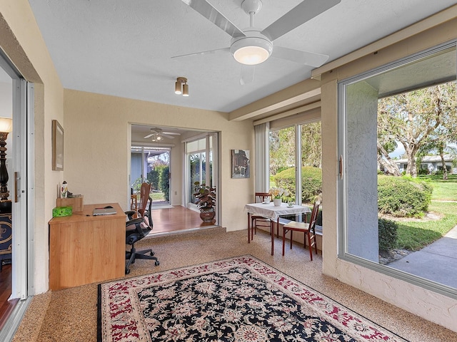 office area with ceiling fan and a textured ceiling