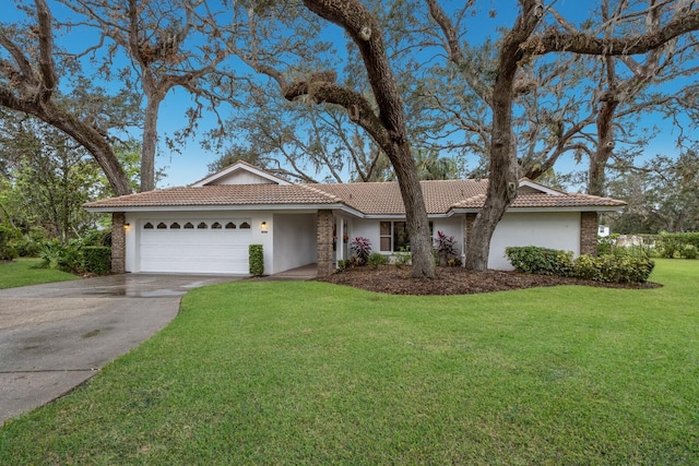 ranch-style house featuring a garage and a front yard