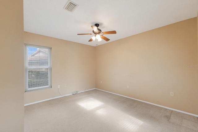 unfurnished room with ceiling fan and carpet floors