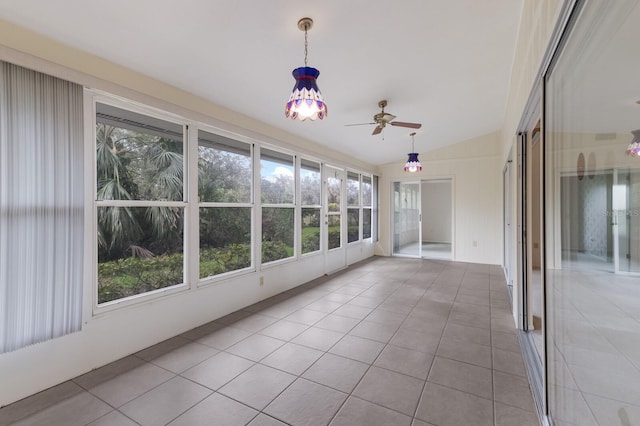 unfurnished sunroom featuring ceiling fan and vaulted ceiling