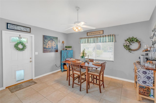 tiled dining room with ceiling fan