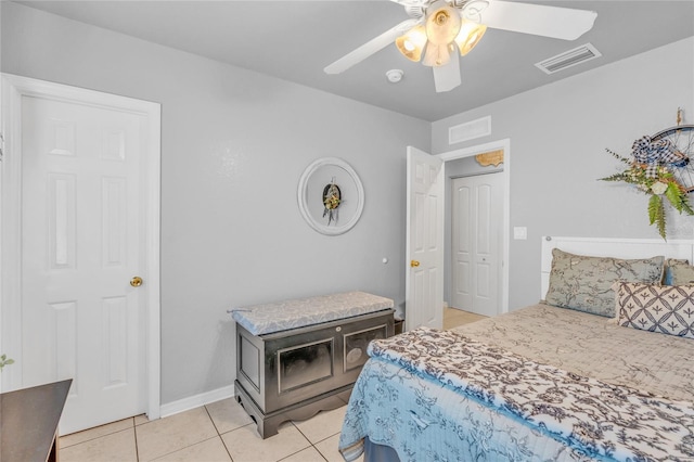 bedroom with light tile patterned floors and ceiling fan