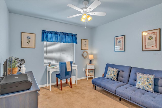 carpeted office space with ceiling fan