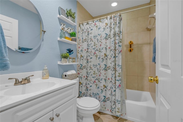 full bathroom featuring vanity, toilet, tile patterned flooring, and shower / bath combo