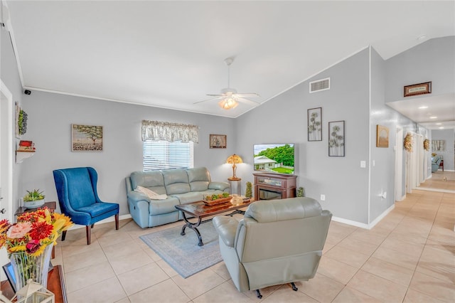 living room with ceiling fan, lofted ceiling, and light tile patterned floors