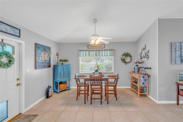 tiled dining room featuring ceiling fan