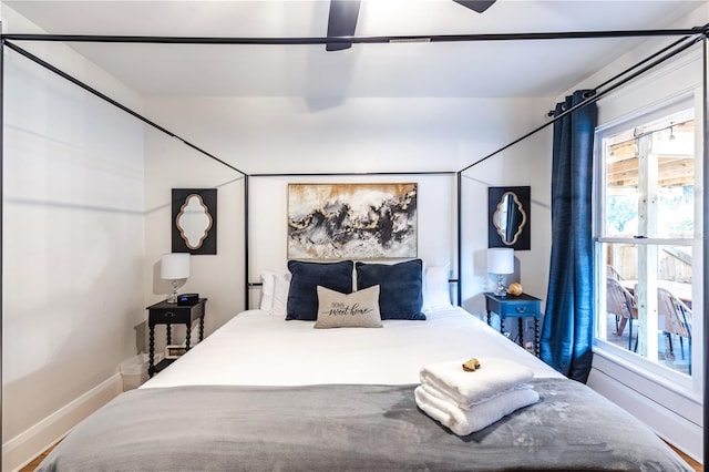 bedroom with ceiling fan and wood-type flooring