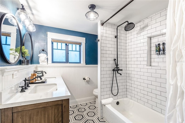 full bathroom featuring vanity, toilet, wooden walls, and shower / tub combo with curtain