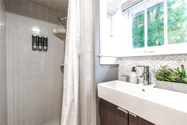 bathroom with a shower with shower curtain and sink