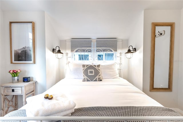 bedroom featuring vaulted ceiling