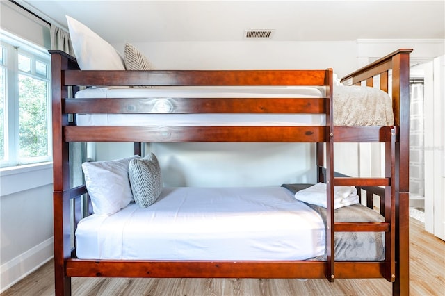 bedroom with light hardwood / wood-style flooring