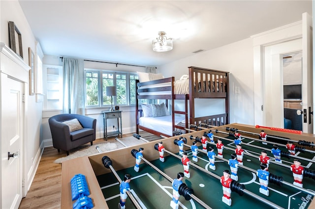 game room with hardwood / wood-style floors