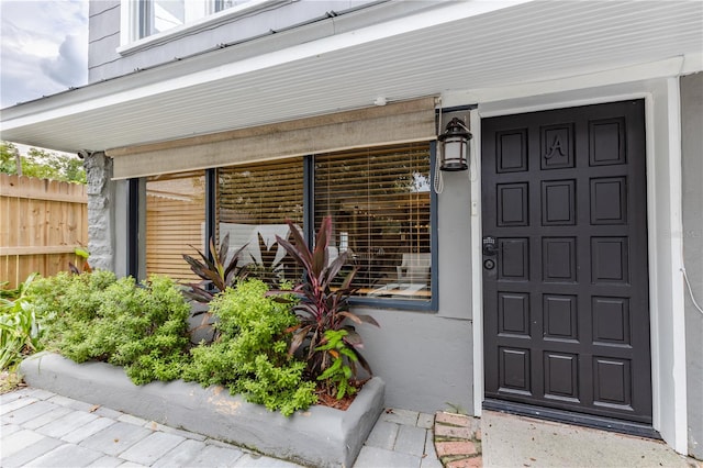 doorway to property featuring a porch