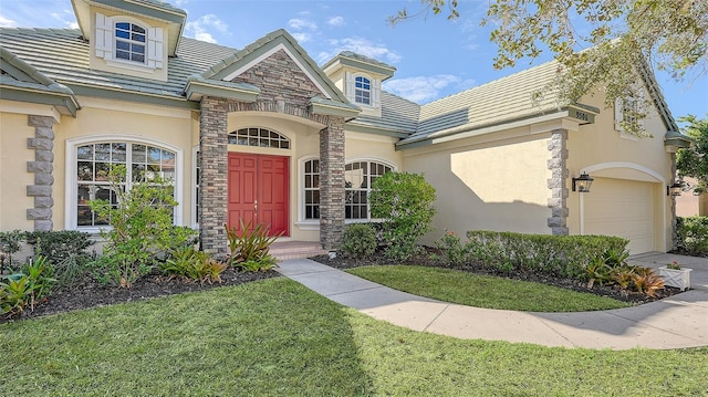 exterior space with a yard and a garage