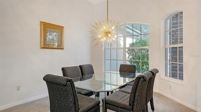 carpeted dining area with a notable chandelier and a towering ceiling