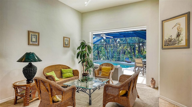 sitting room featuring light colored carpet