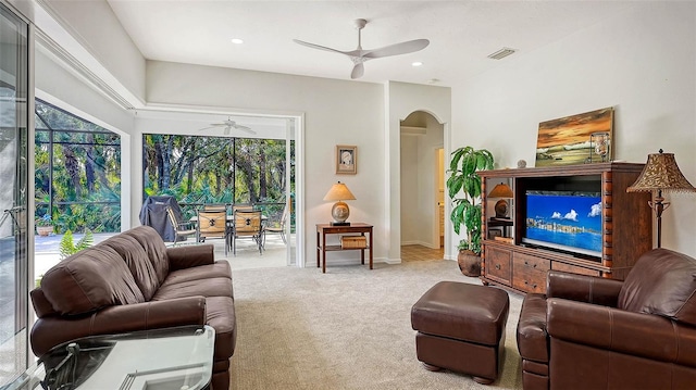 living room with light carpet and ceiling fan