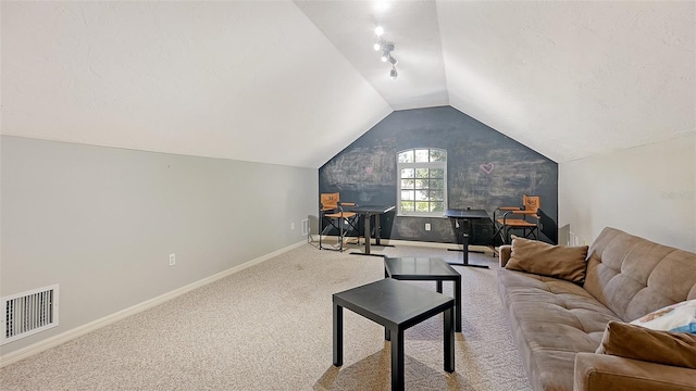 living room featuring light colored carpet and lofted ceiling