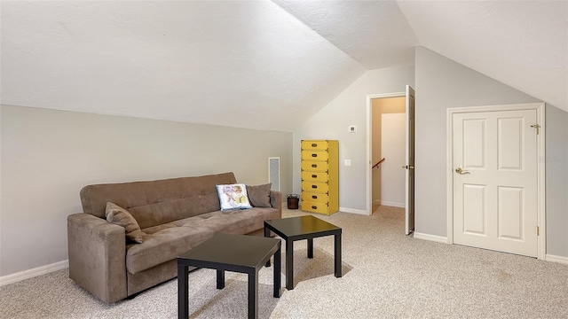 living room featuring light colored carpet, a textured ceiling, and vaulted ceiling