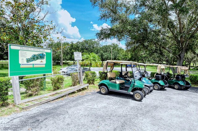 9506 Royal Calcutta Pl, Lakewood Ranch, FL 34202 - view of parking featuring view of scattered trees